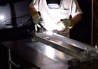 man welding some metal